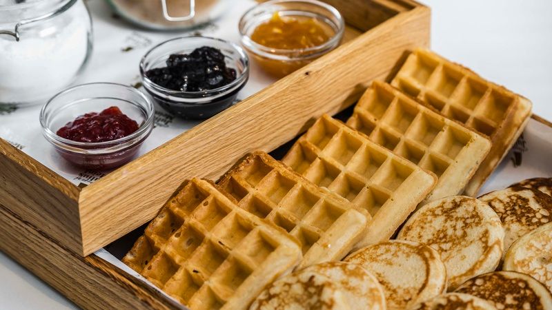 Detail of pancakes and waffles with selection of jams in The Julius Prague