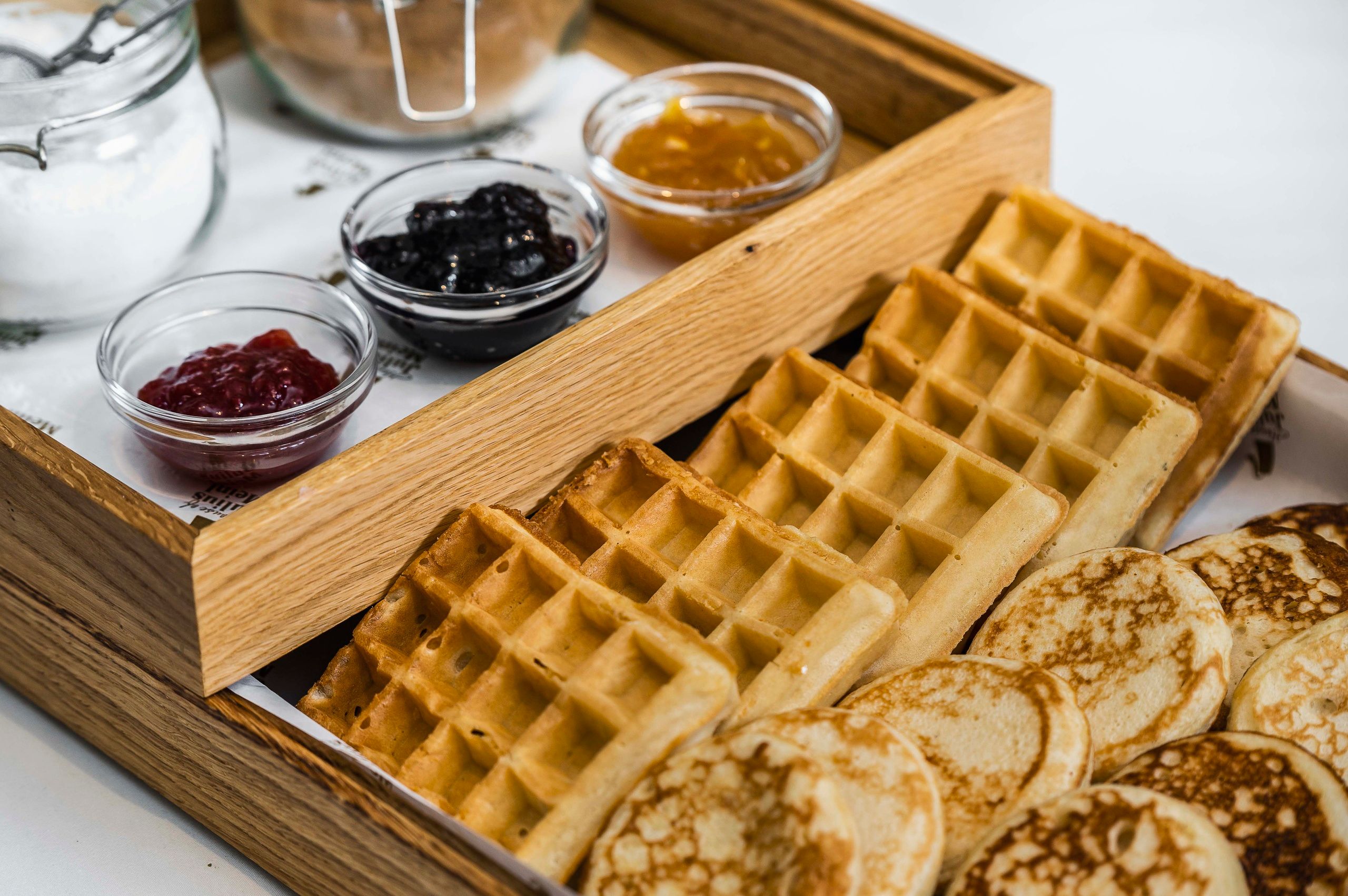 Detail of pancakes and waffles with selection of jams in The Julius Prague 