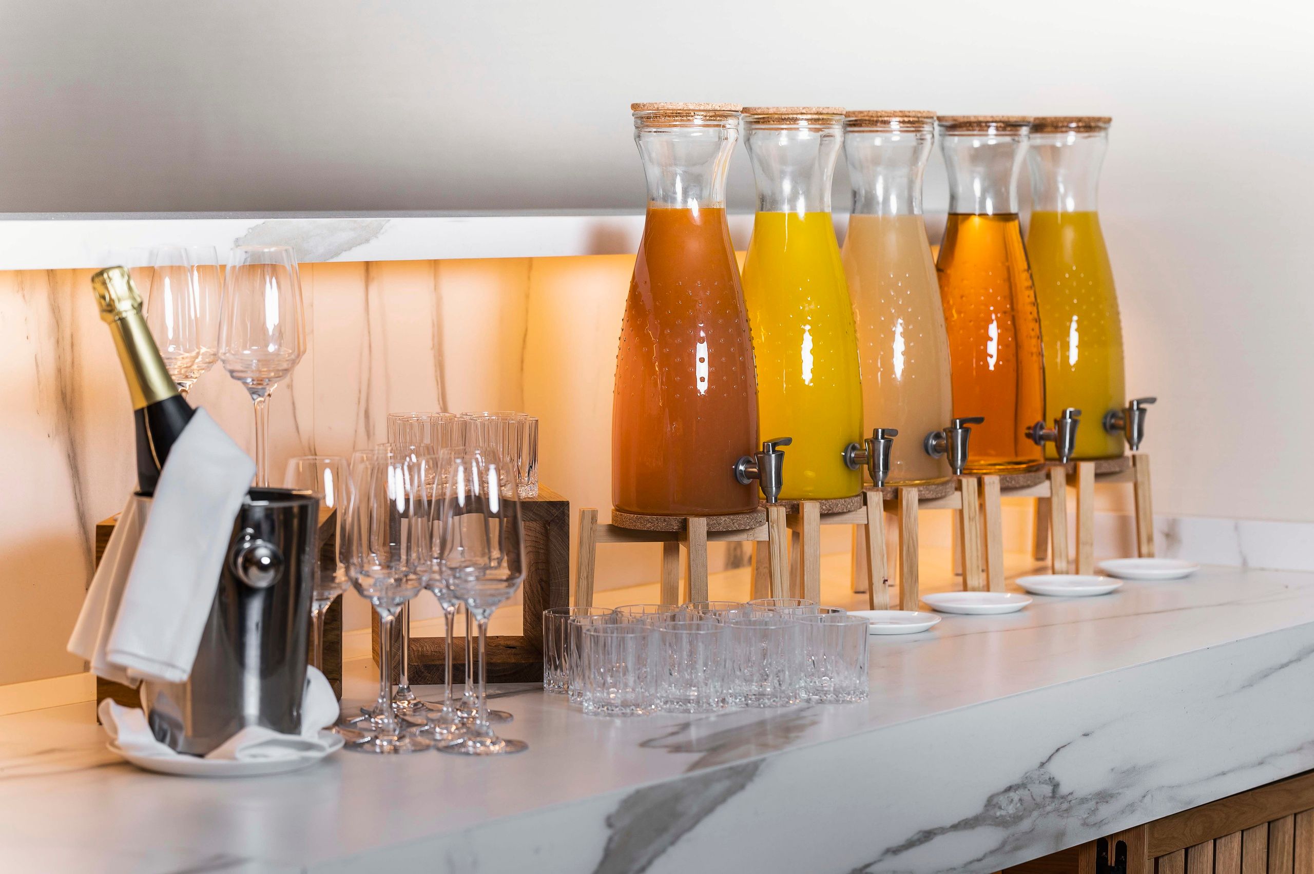 Selection of juices and sparkling wine for the breakfast buffet in The Julius Prague 