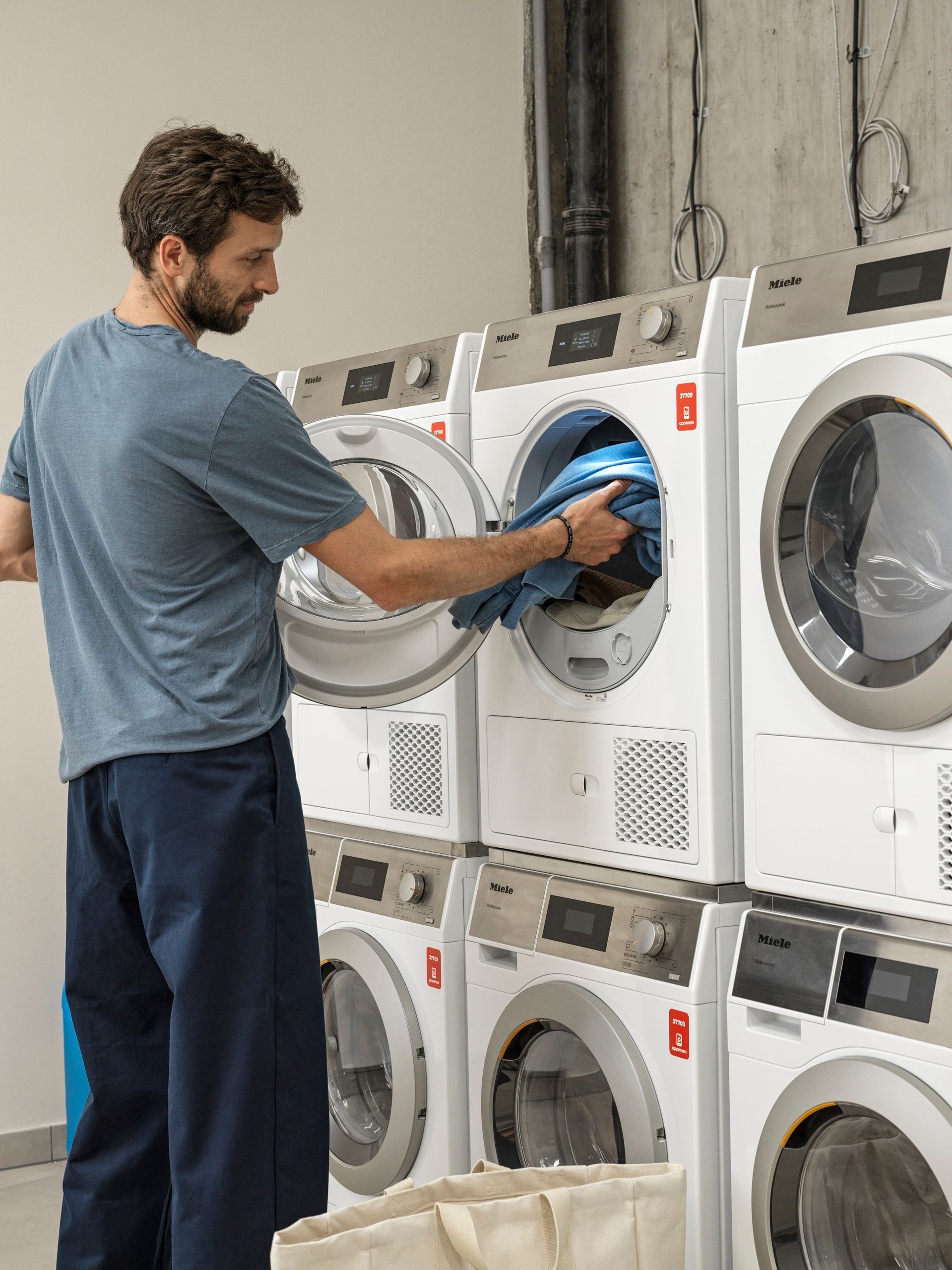 Man doing his laundry in The Julius Prague 