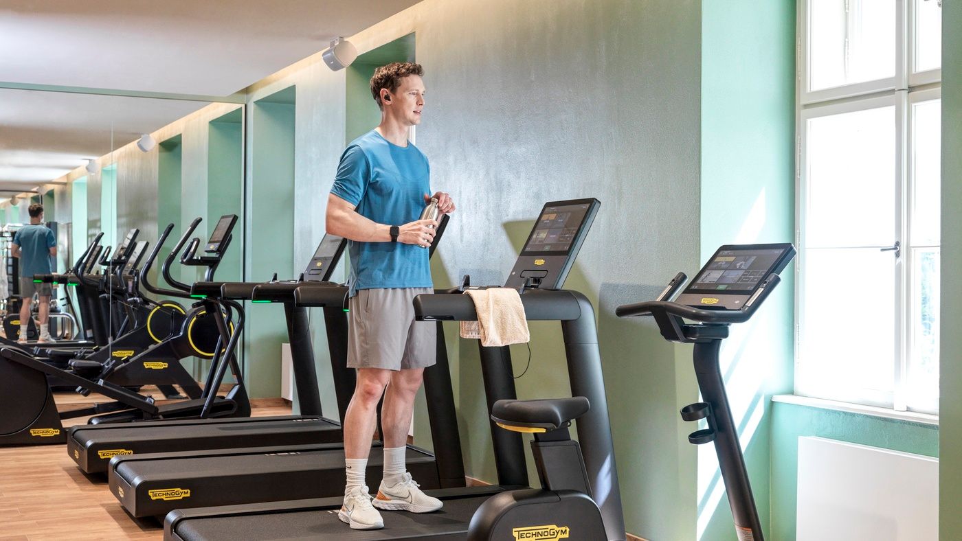 Man on treadmill in gym, The Julius Prague
