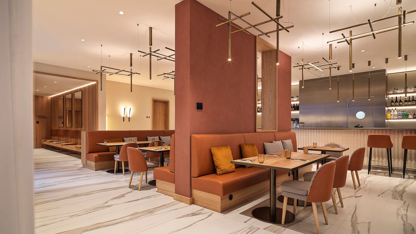 Tables and chairs in Emporium Bistro & Bar in The Julius Prague