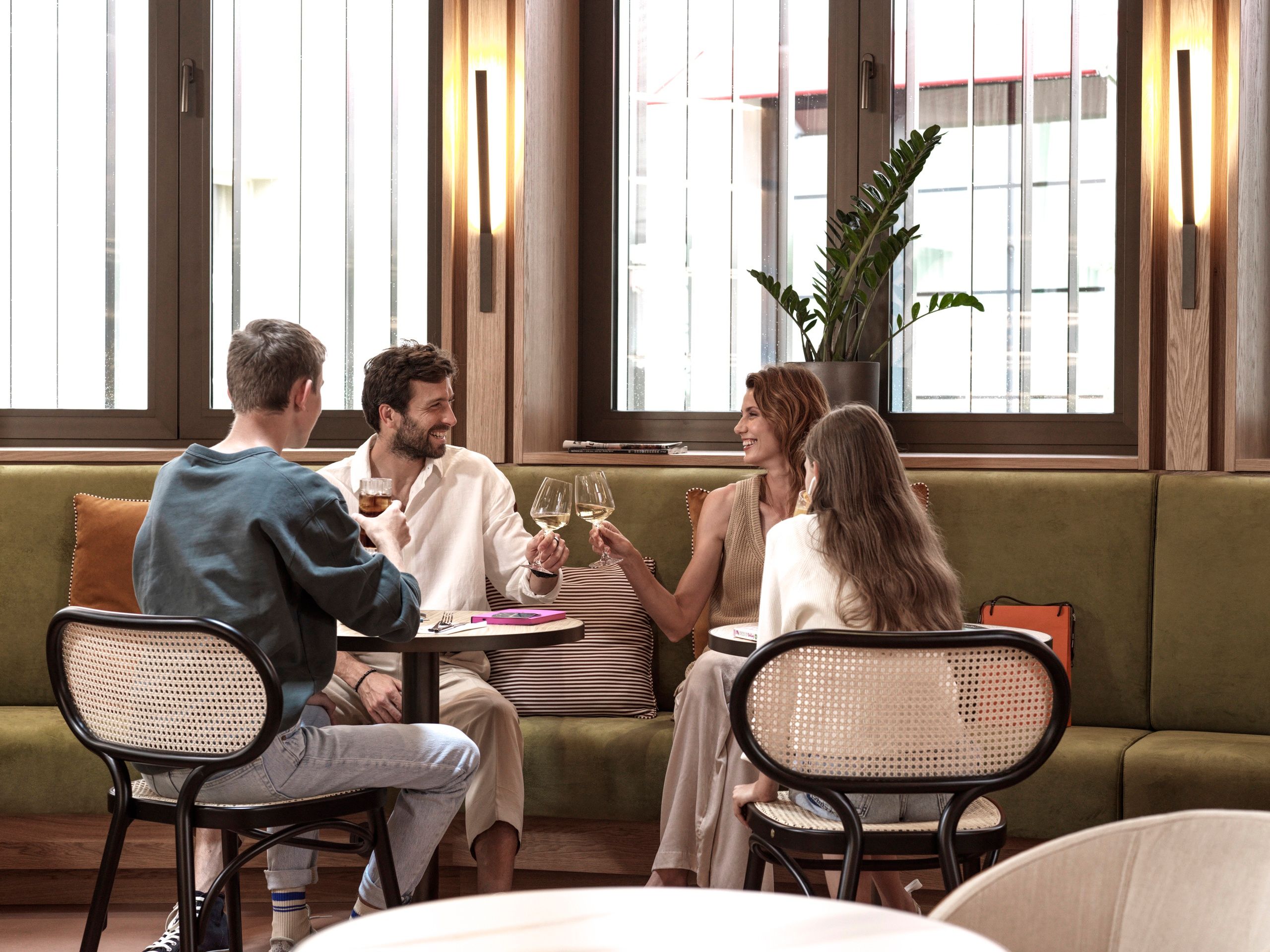 Family with drinks in Emporium Bistro in The Julius Prague 