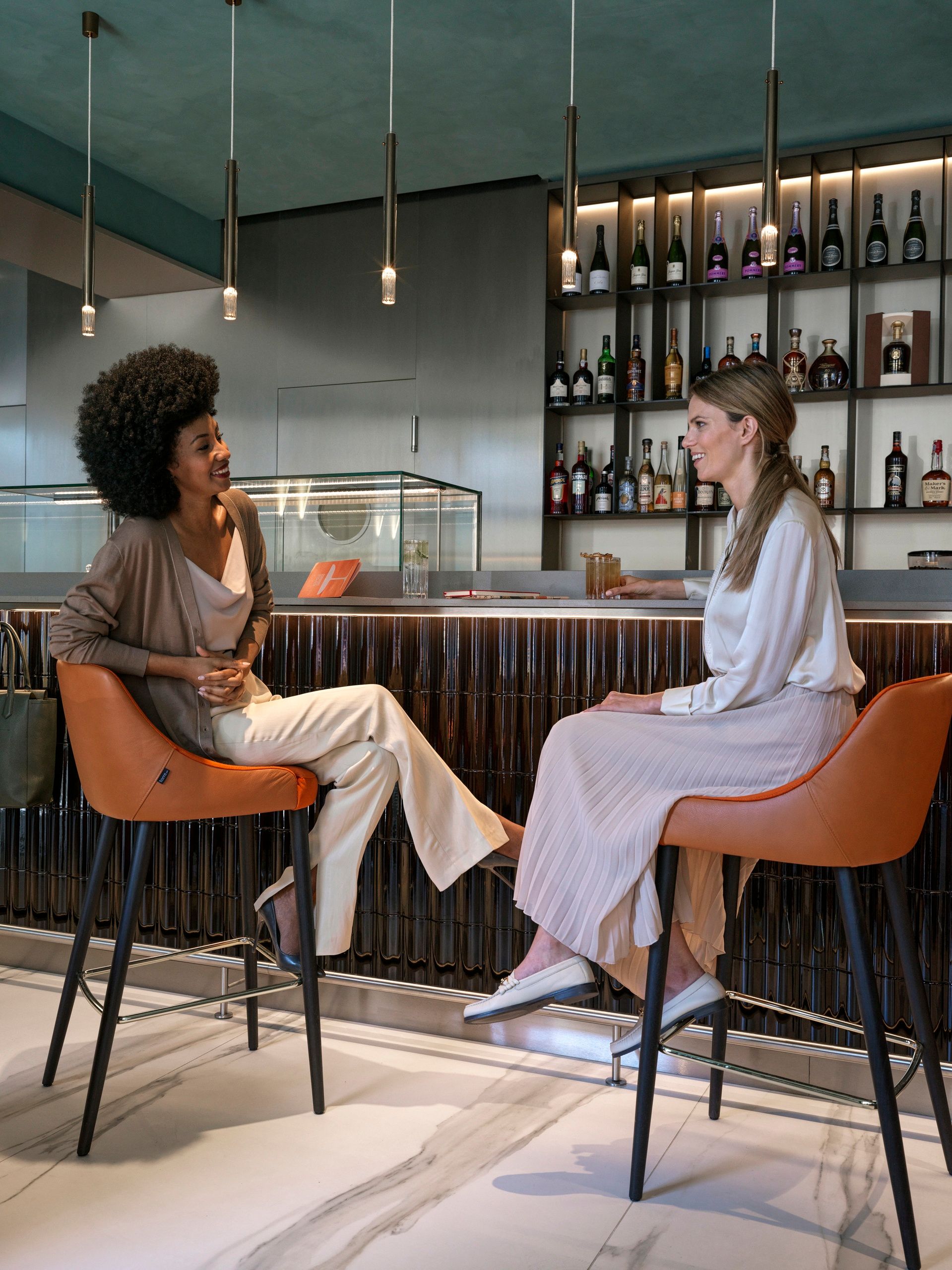 Women chatting in Emporium Bistro & Bar, The Julius Prague 