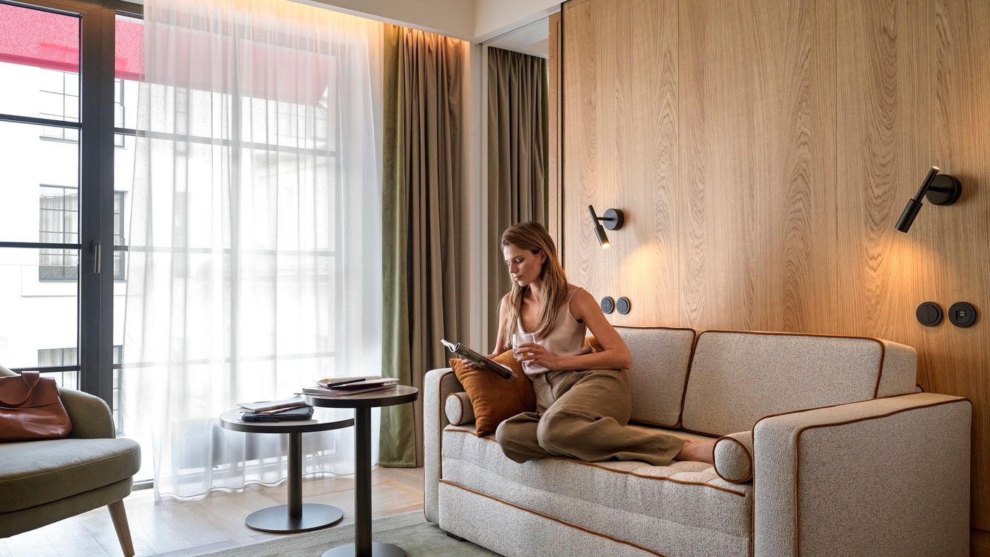 Lady sitting on sofa in living room