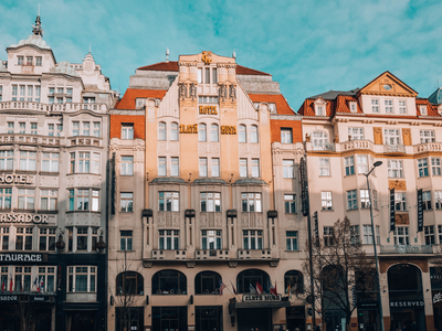  Wenceslas Square Bathed in Golden Sunlight: A sunny day transforms Wenceslas Square, casting a warm, soft glow over the buildings. The gentle colors create an inviting and serene atmosphere, showcasing the square's architectural beauty and historical importance.