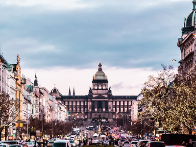  Wenceslas Square in Pristine Serenity: A captivating view of Wenceslas Square under a cloudy yet picturesque sky. The vivid, cool colors of the scene complement the architectural elegance, featuring the imposing National Museum. This image captures the square's unique charm and historical significance in a moment of quiet beauty.